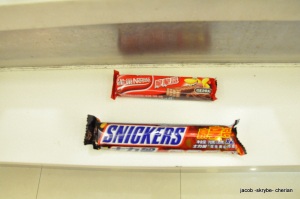 A Snickers Bar and  Nestle Wafer Chocolate Bar